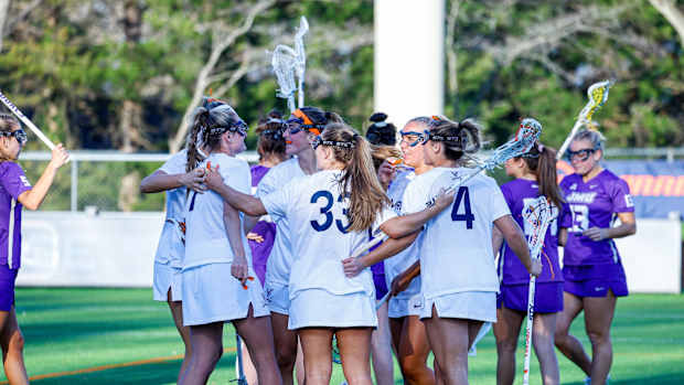 The Virginia women's lacrosse team celebrates after scoring a goal against James Madison at Klockner Stadium.